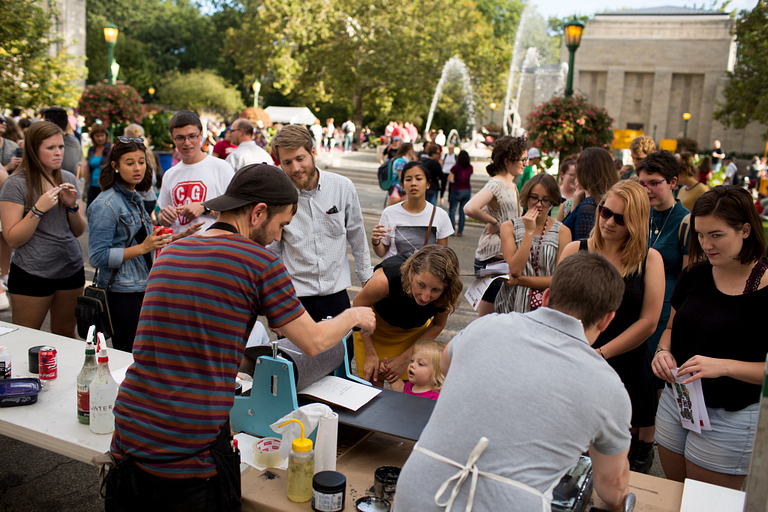 Guests wait to make prints at one of last year's First Thursdays festivals