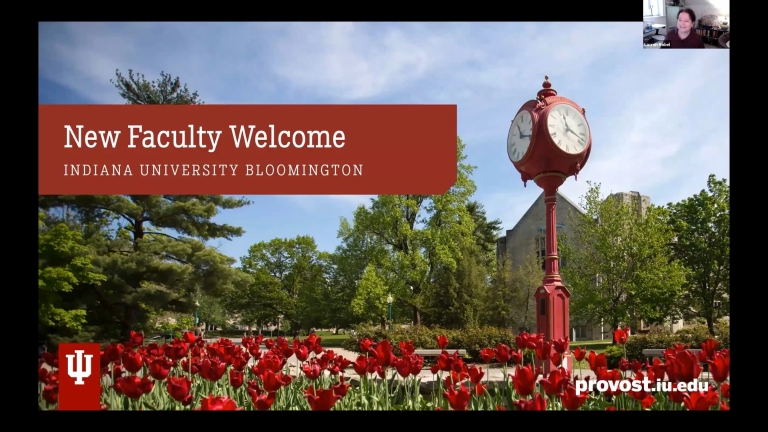 screenshot says new faculty welcome while showing red tulips and a campus clock