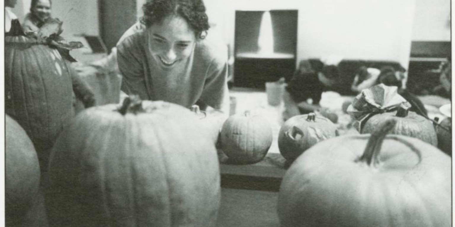 A student carves a pumpkin in 1995