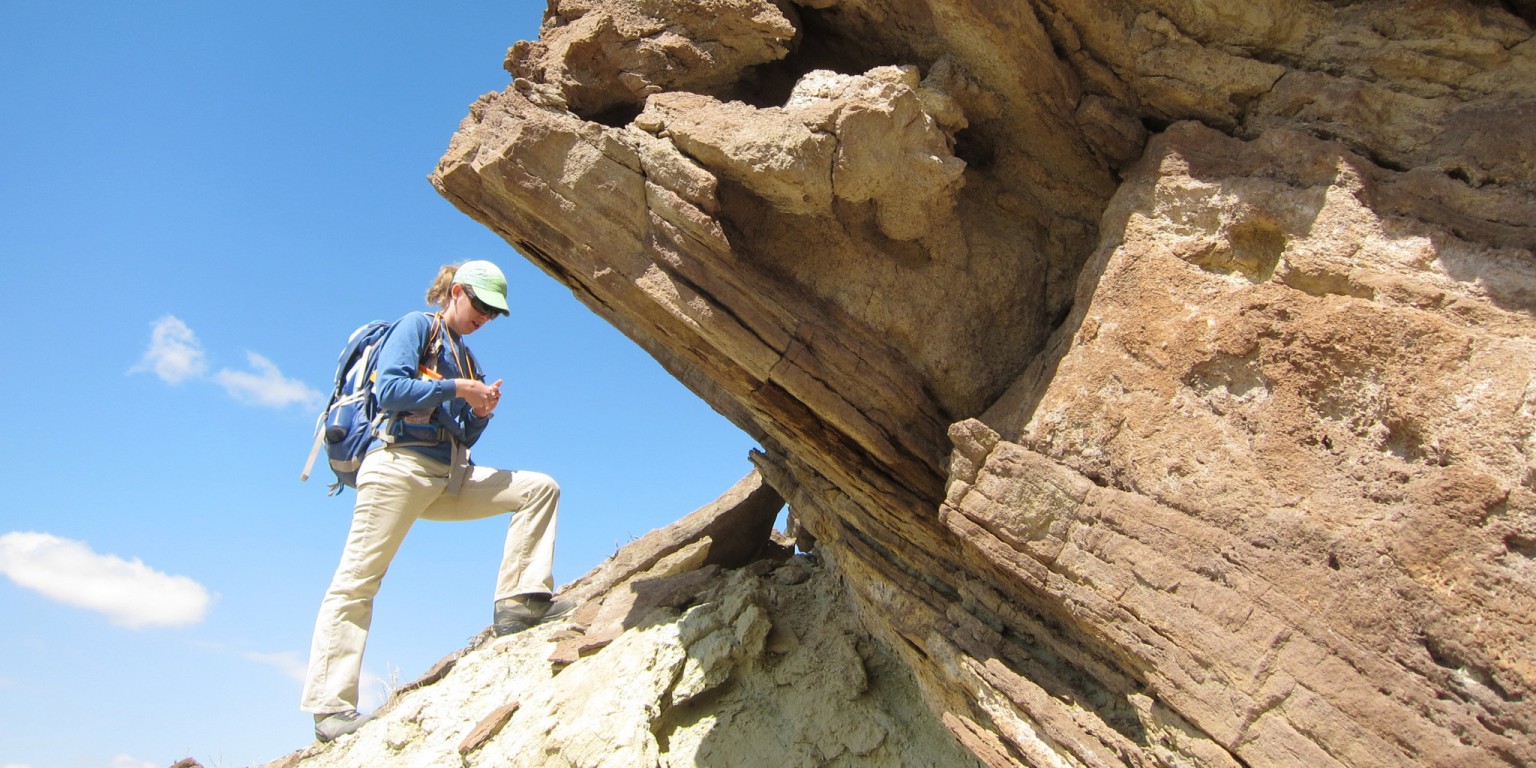 Tara Smiley stands on a rock formation