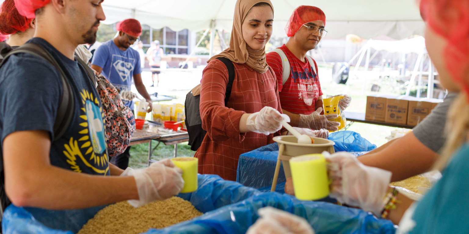 Students pack meals for the Million Meal Movement.