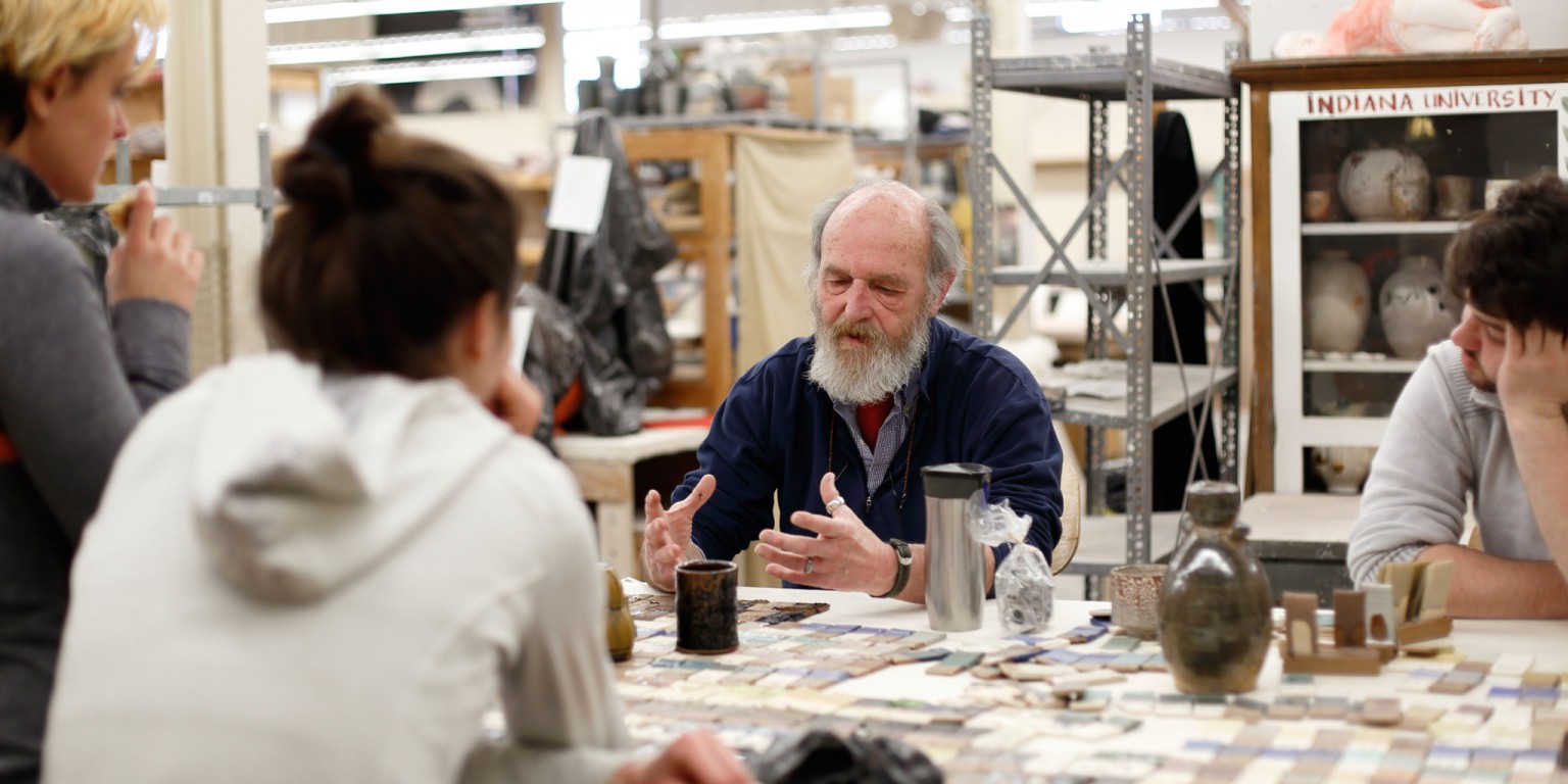 A ceramics professor speaks to a class in the new School of Art and Design.