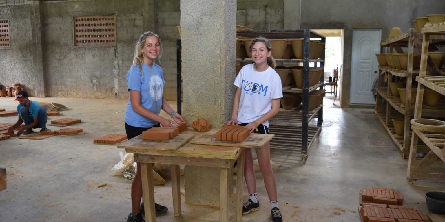 Maria Bluck and Lucy Brown working in the water filter factory. 