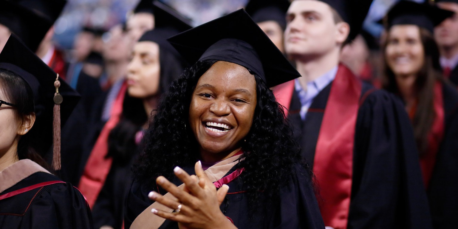 A student celebrates at Commencement.