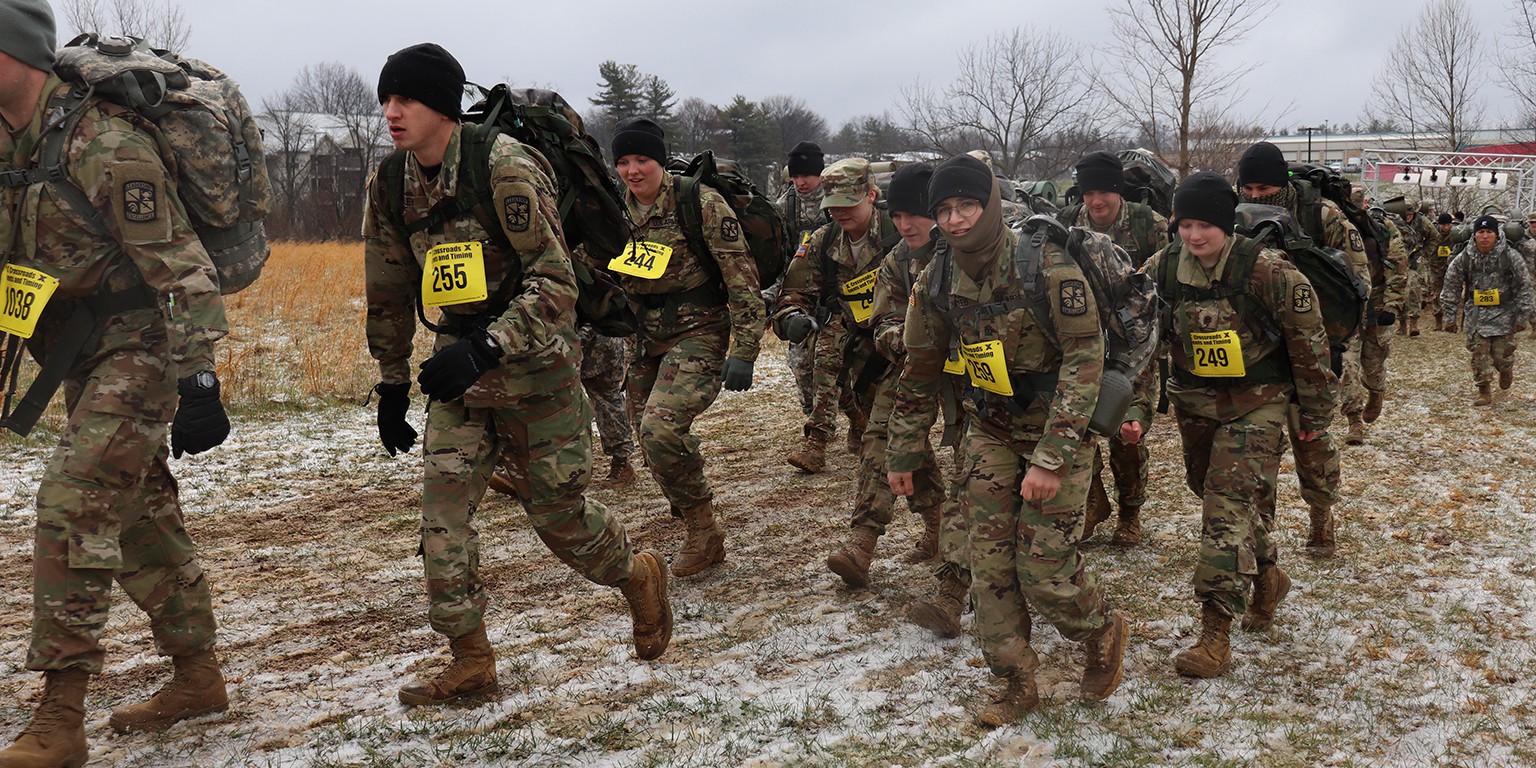 Participants march with 33 pounds of gear on their backs.