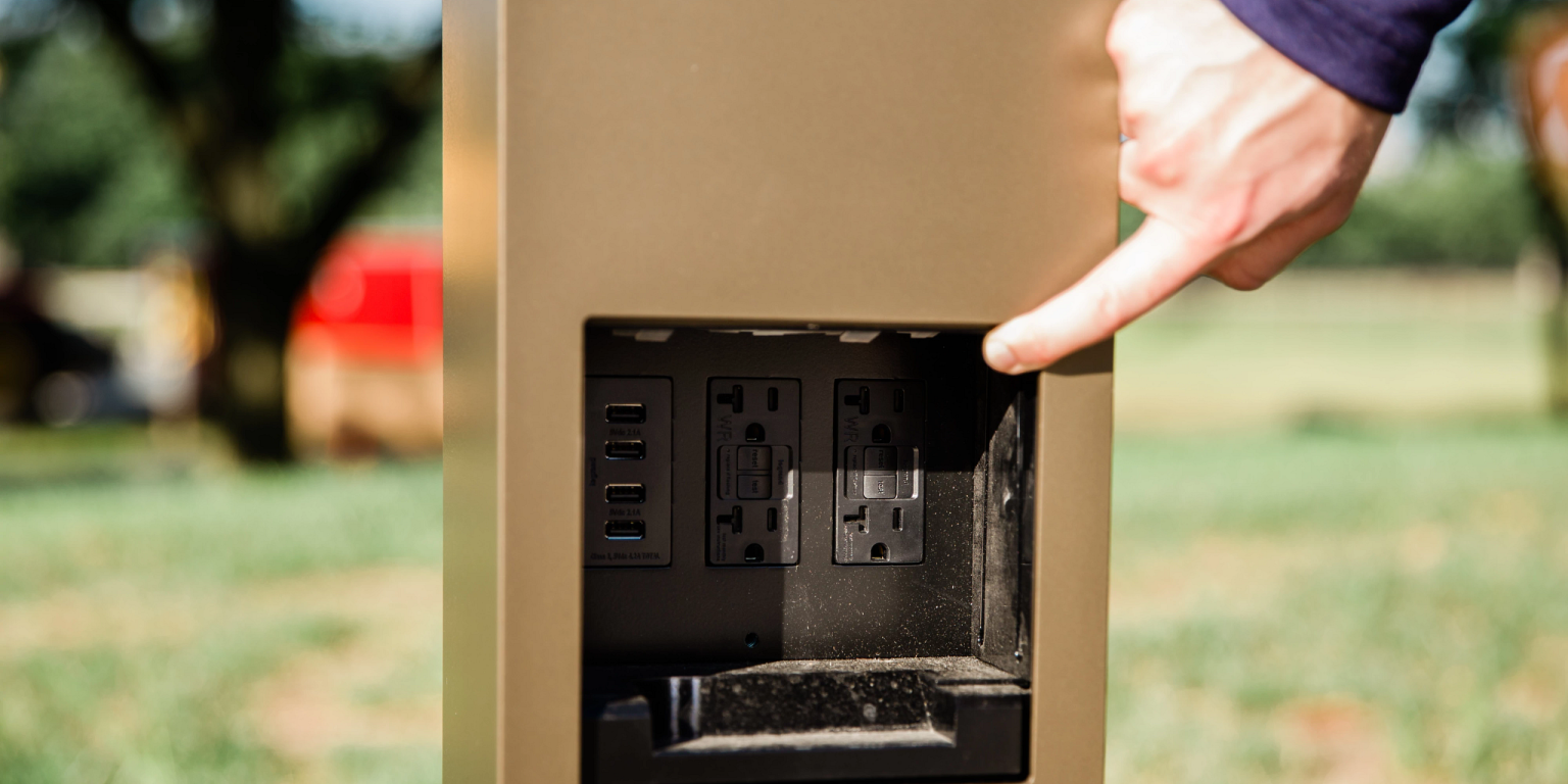 an outdoor terminal with outlets and USB ports