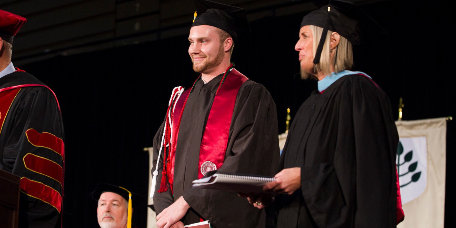 Graduate Lucas Huffman prepares to address the graduating class at the IU East commencement ceremony