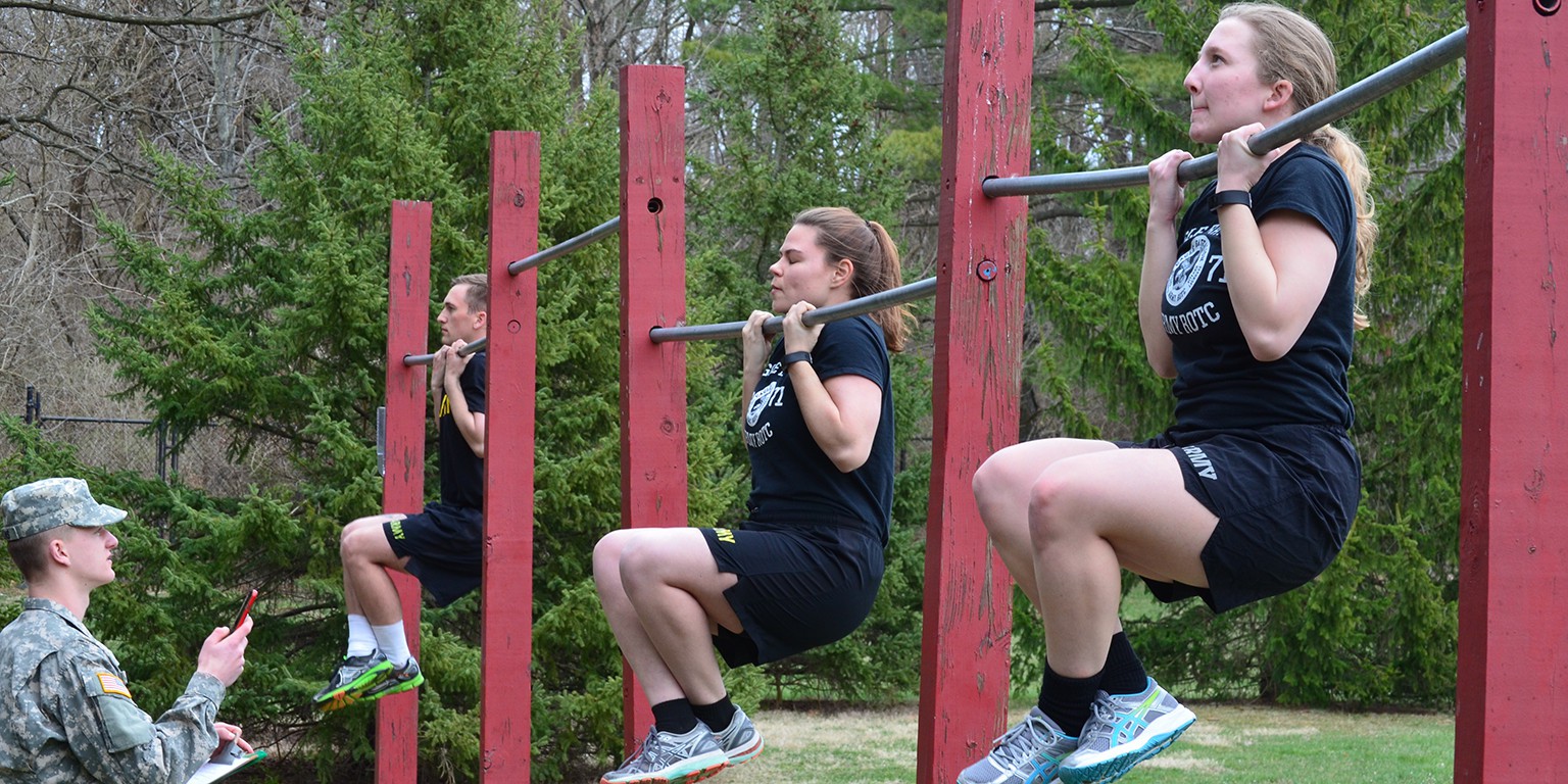 Competitors take part in the arm hang portion of the competition. 