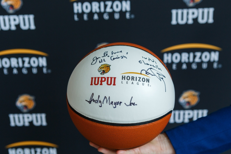 A basketball with IUPUI and The Horizon League's logos printed on it.