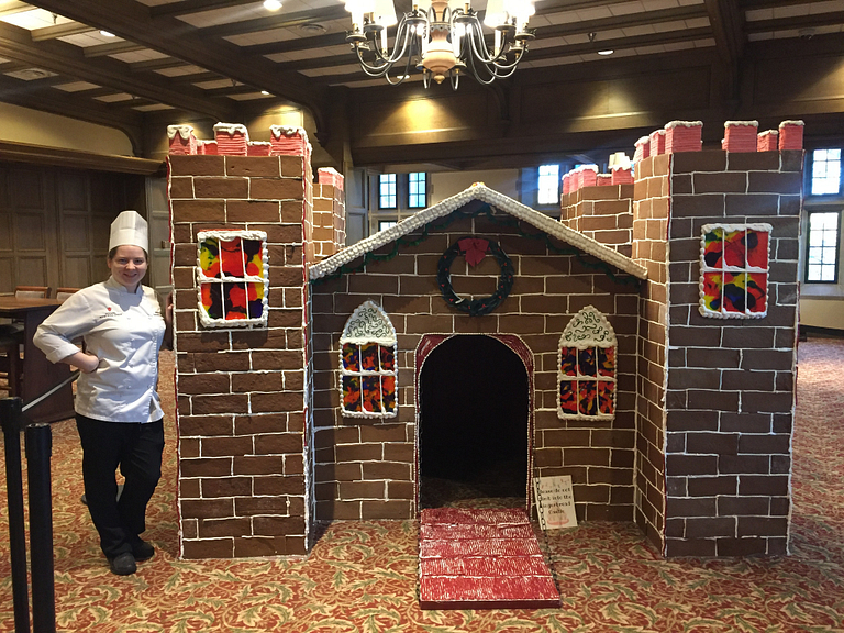 Ashley Massie with the giant gingerbread house in the Indiana Memorial Union