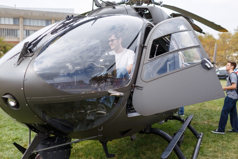 Student sits in a Blackhawk helicopter.