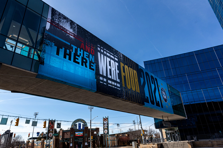 A graphic on a skywalk reads "And then there were four"