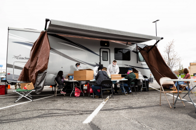 A Phase 1 study site is set up in a parking lot in late April 2020