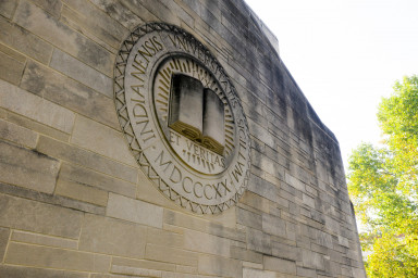IU's motto "Lux et Veritas" appears on the side of a limestone building. 