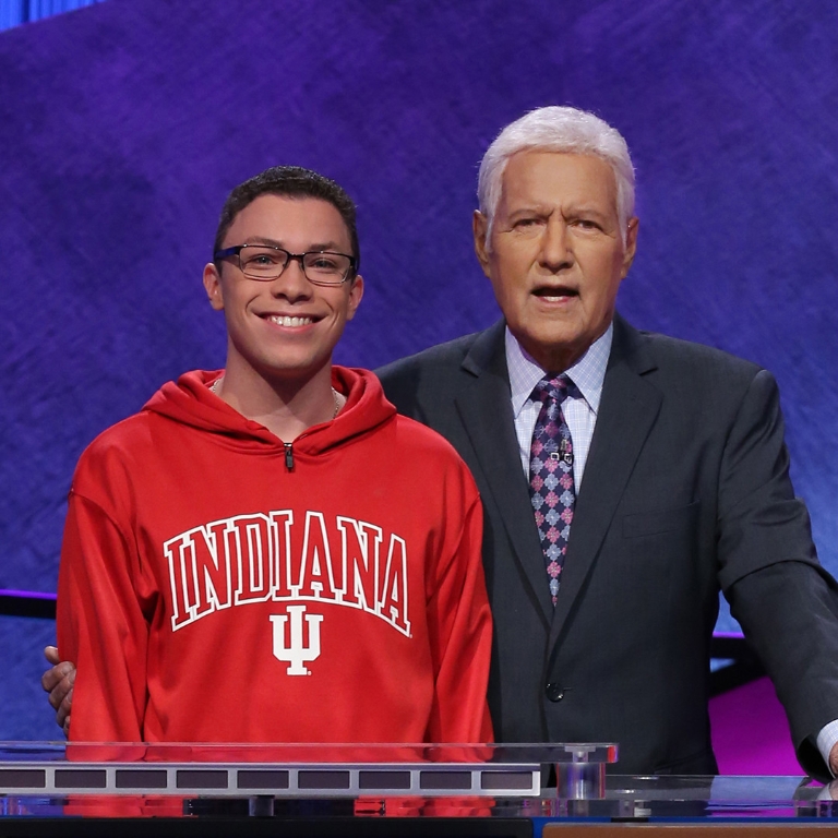Student Tyler Combs on the set of Jeopardy with host Alex Trebek