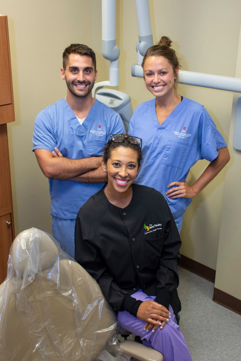 Adjunct faculty member Dr. Elizabeth Simpson with two fourth-year dental students