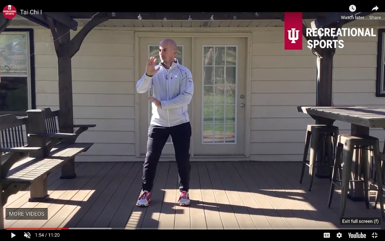 An IU personal trainer performs tai chi on his back patio