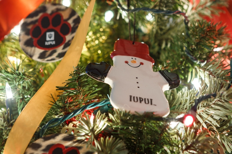 IUPUI snowman ornament hangs on an IUPUI-themed Christmas tree.
