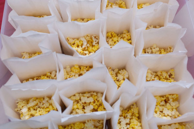 Bags of popcorn lined up on a table