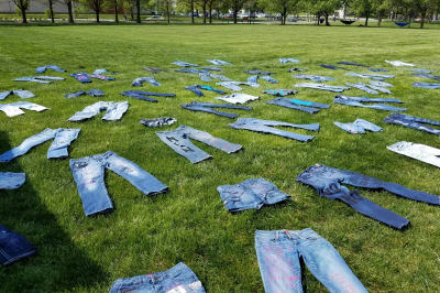 Denim pants lay on a lawn on the IUPUI campus.