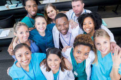 A group of medical students looking up at the camera