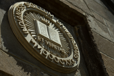 The IU seal on a building