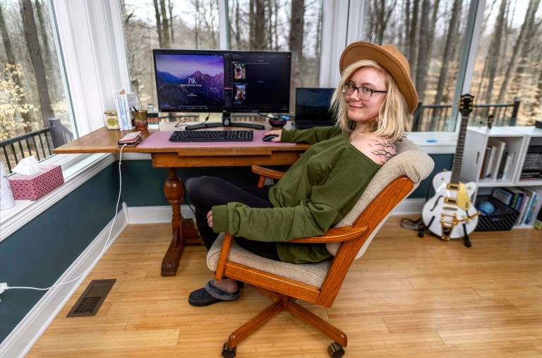 woman sitting at a computer desk