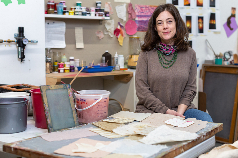Sarah Strong sits in her studio.