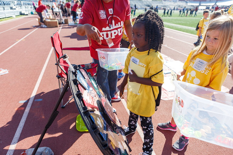 A kindergartner visits Carroll Stadium.