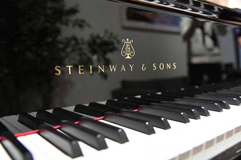Closeup of the keyboard of a Steinway piano.