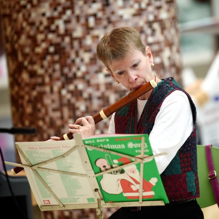 Professor Sara Hook plays the flute.