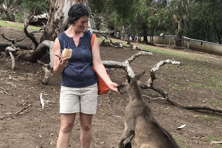 Deborah Widiss feeds a kangaroo