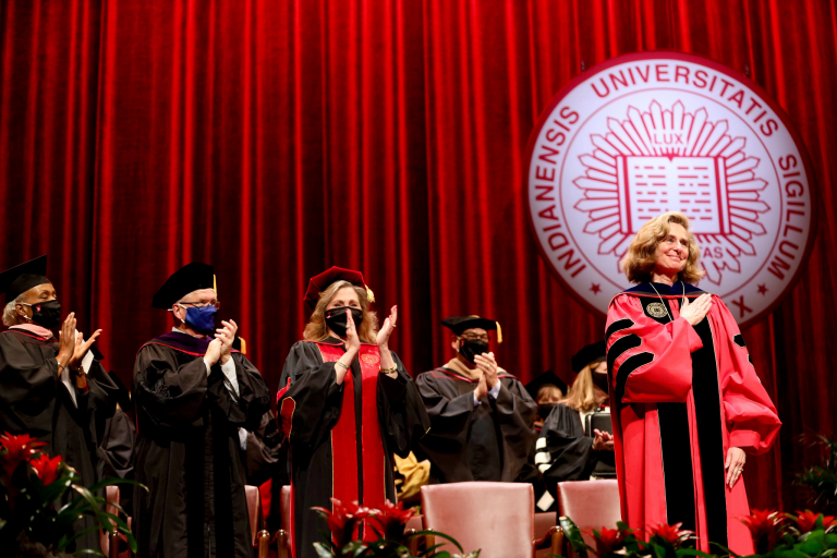 IU President Pamela Whitten on stage after being inaugurated, as others on stage clap
