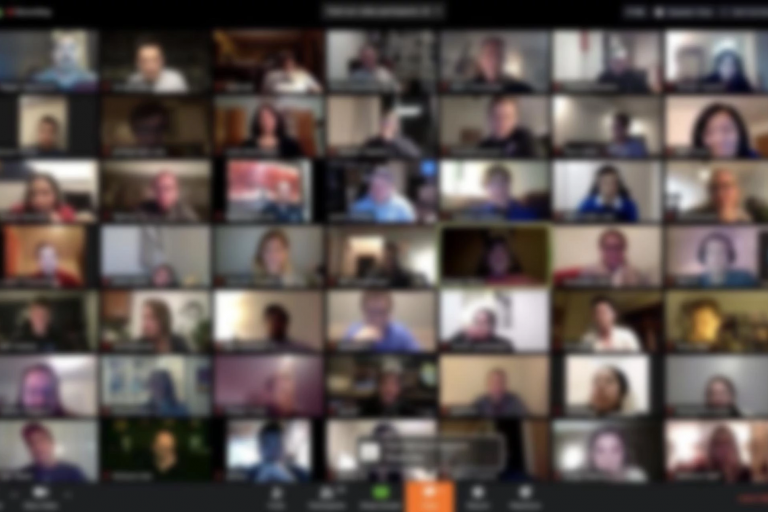 Images of many people on video screens during Zoom meeting