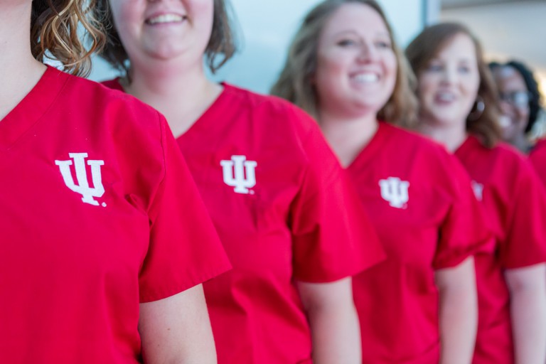 IU nursing students in red scrubs