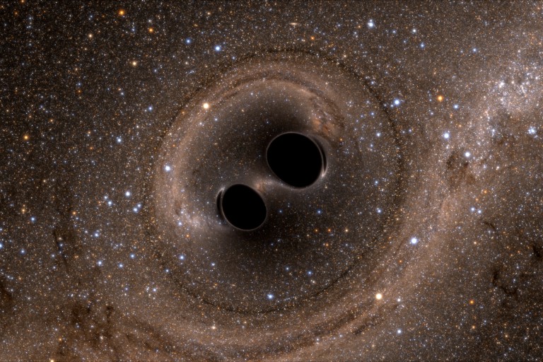 Illustration of two black holes merging into one. Credit: SXS