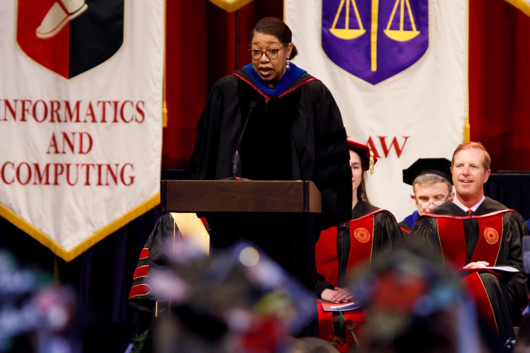 Robin Hughes presents Education degrees at commencement
