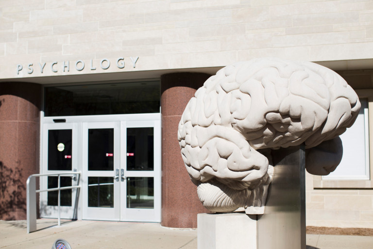 Limestone sculpture of a brain outside the IU Bloomington psychology building