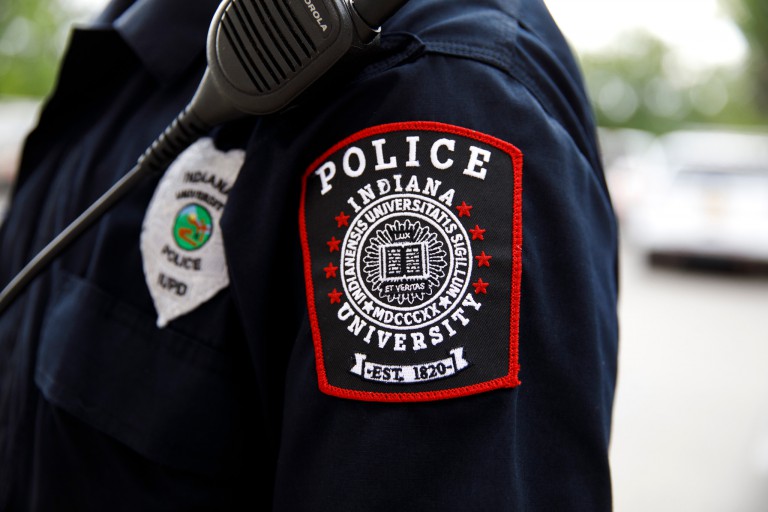 The IU Police Department patch on the uniform of an officer.