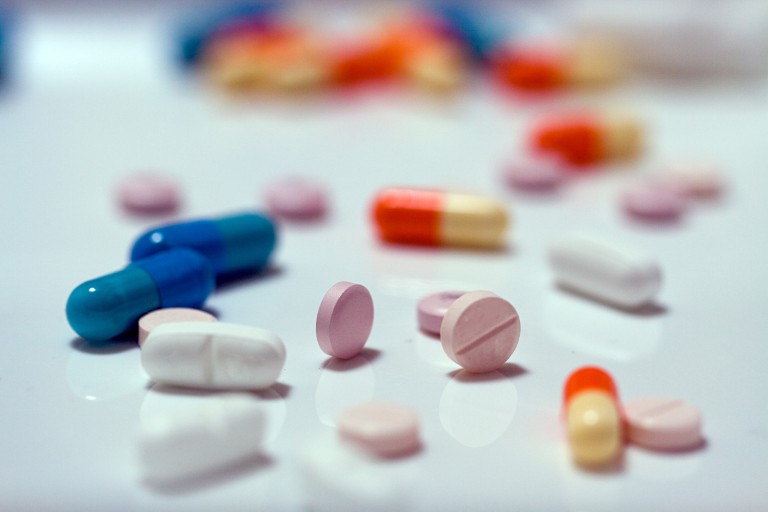 Assorted pills on a surface