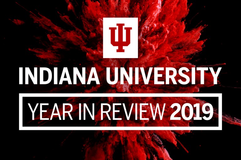 Words say "Indiana University, Year in Review 2019" and a splash of red is behind it