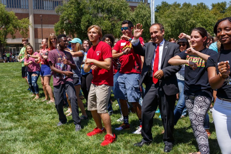 Chancellor Paydar dances with students on campus.