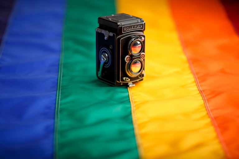 Rolleiflex camera on rainbow flag