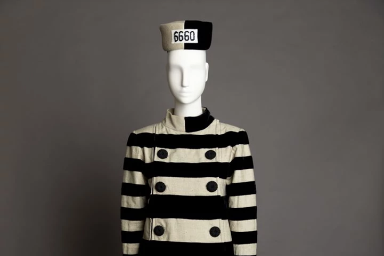 Cruella De Vil's prison costume dressed on a mannequin