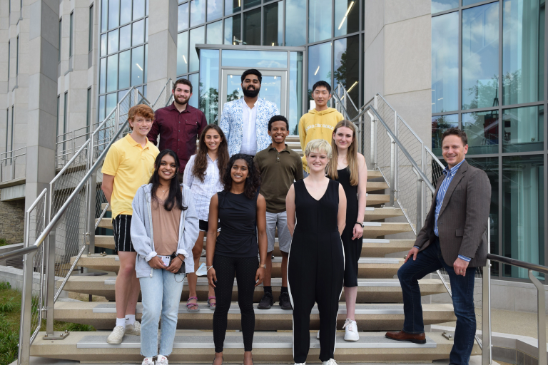 The 2021-22 Shoemaker Scholars standing on steps outside Luddy Hall