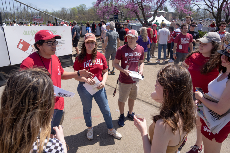 Students hand out information at Little 500