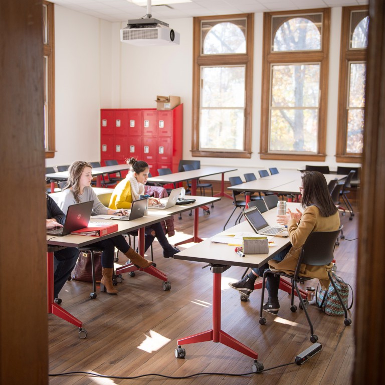 Students take a class inside the new School of Art and Design.