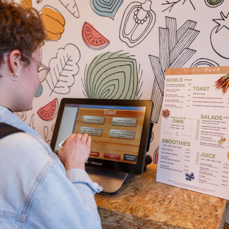 A student orders at a kiosk