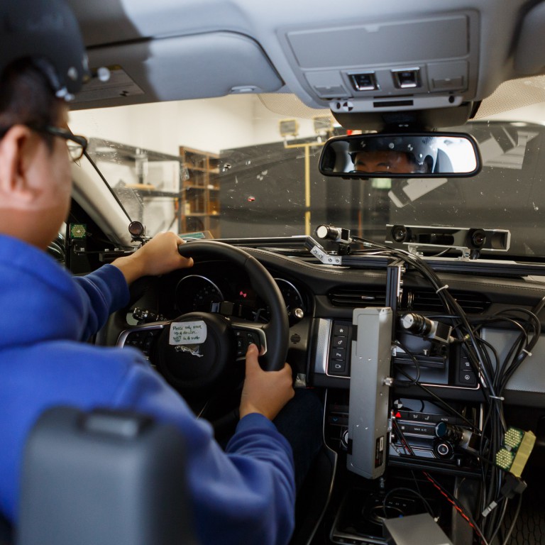 Dan Chen at the steering wheel of a test car