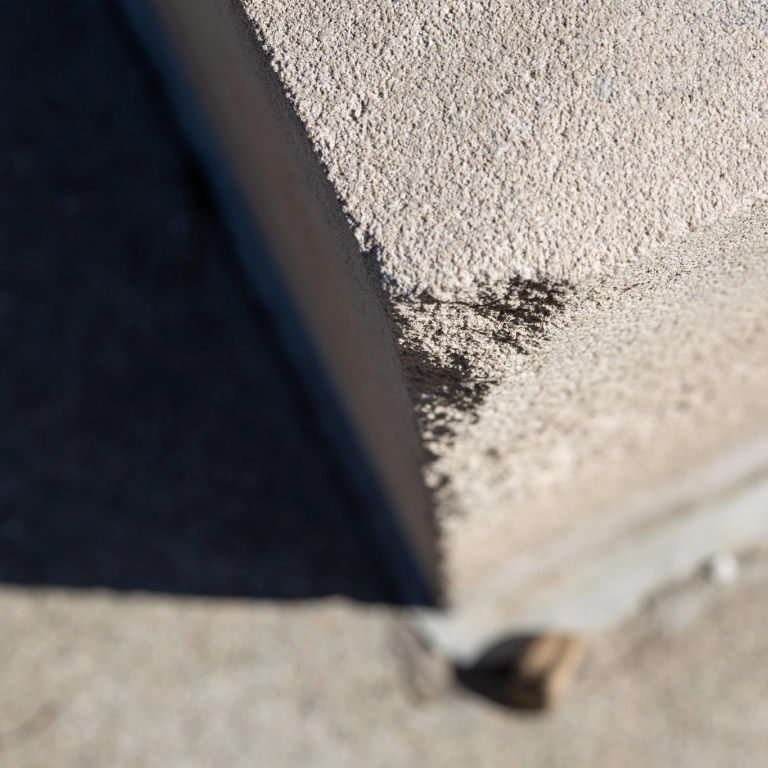 A small chunk of limestone is worn away on the bust of Bill Armstrong. 